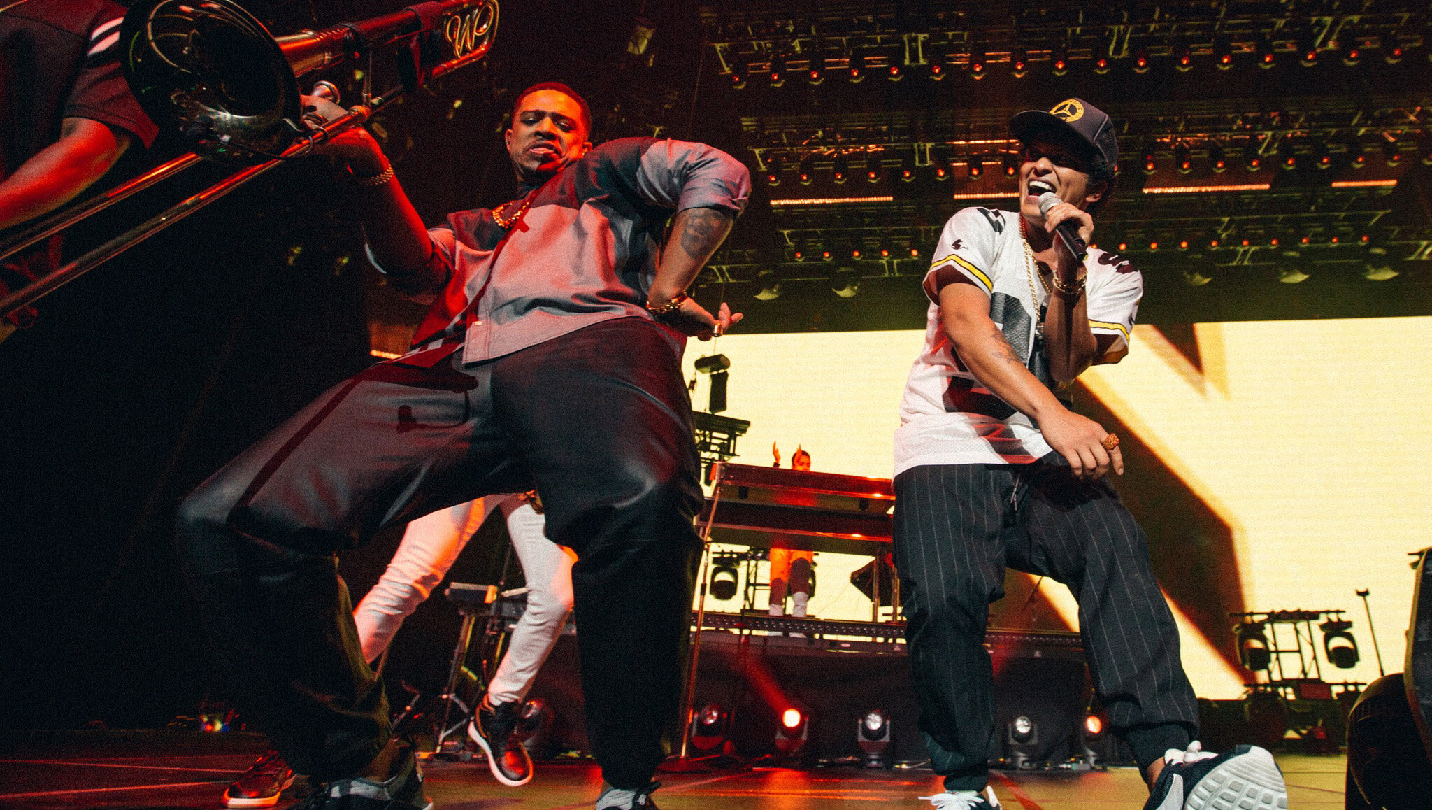 Bruno Mars performs with a trombonist at Cisco Live.