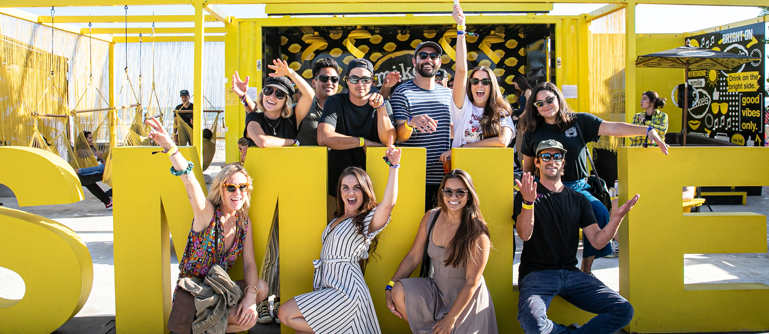 People smile for the camera at the Mike's Hard Lemonade activation event.