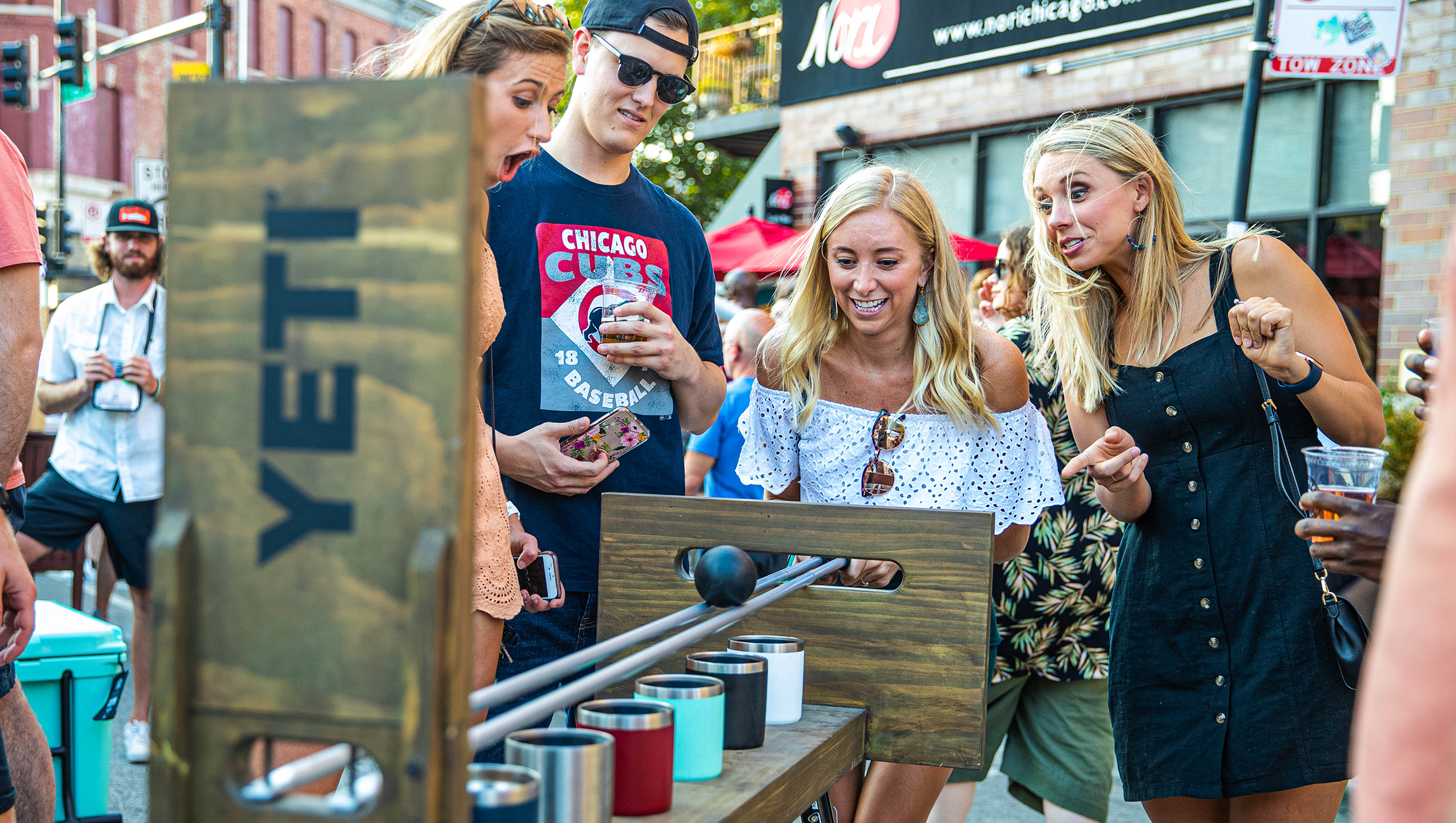 Fans play a game at the YETI pop-up.