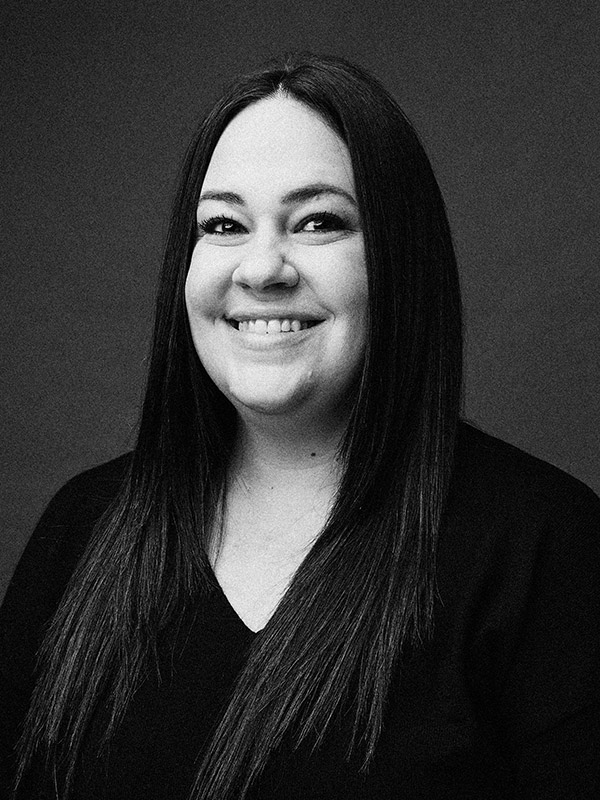 A black and white headshot of Becca Ornstein.