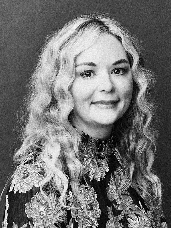 A black and white headshot of Jasmine Evans.