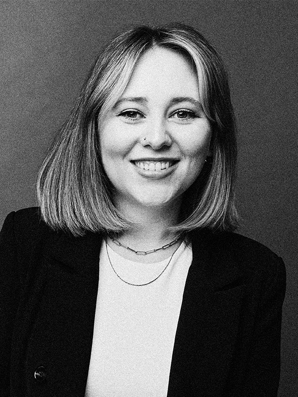 A black and white headshot of Meghan Uhrick.