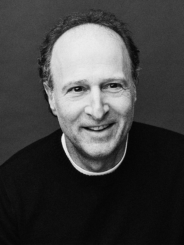 A black and white headshot of Michael Boltzman.