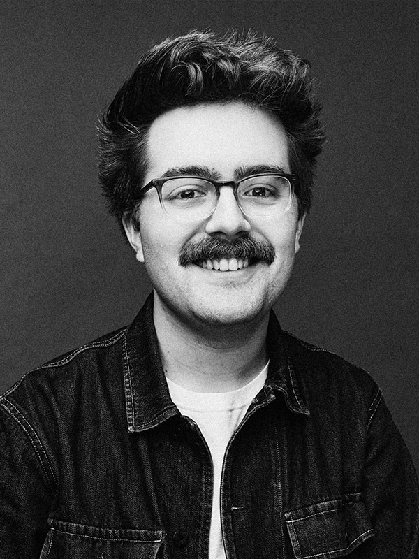 A black and white headshot of Paul Ermlich.