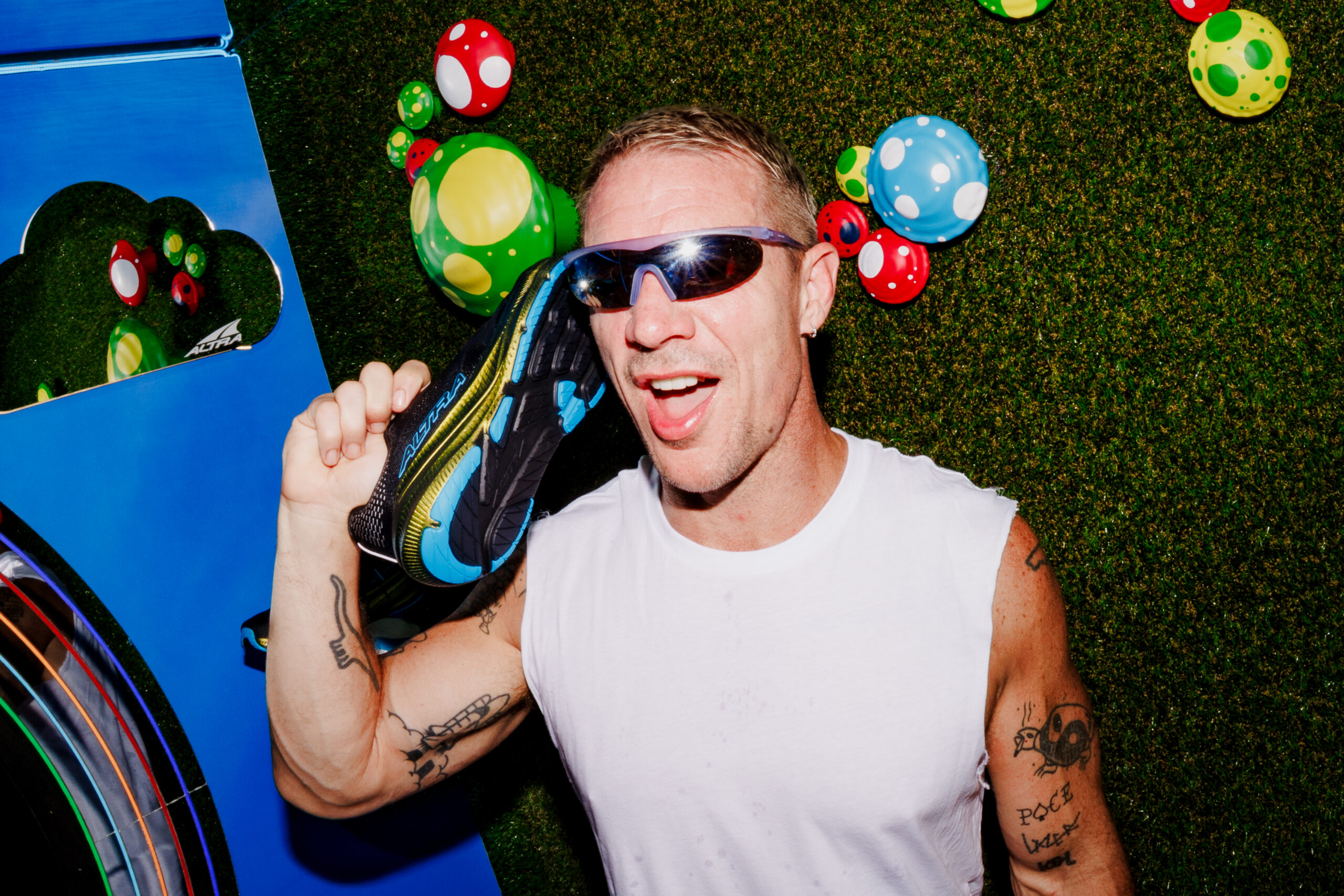 Diplo posing with Altra shoe at Diplo's Run Club Tour